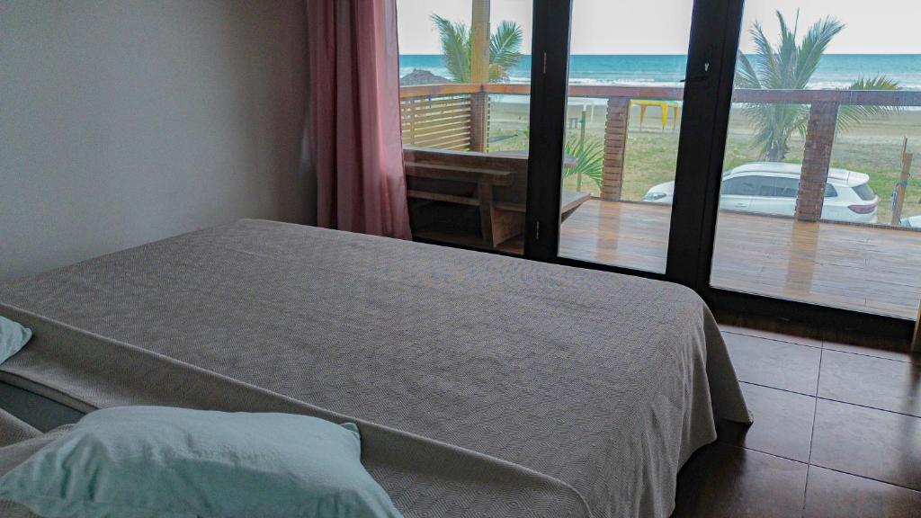 Postel nebo postele na pokoji v ubytování Suite La Isla