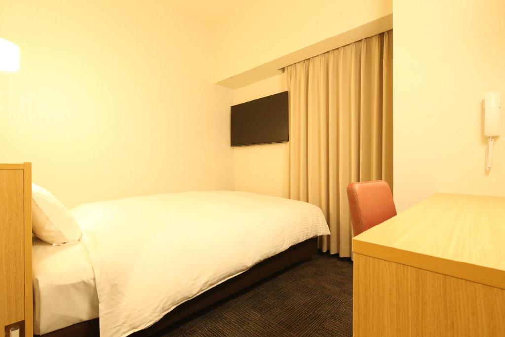 Ένα ή περισσότερα κρεβάτια σε δωμάτιο στο AB Hotel Anjo