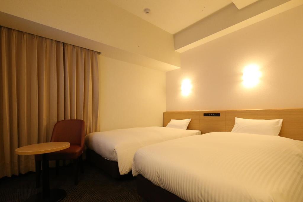 Ένα ή περισσότερα κρεβάτια σε δωμάτιο στο AB Hotel Anjo