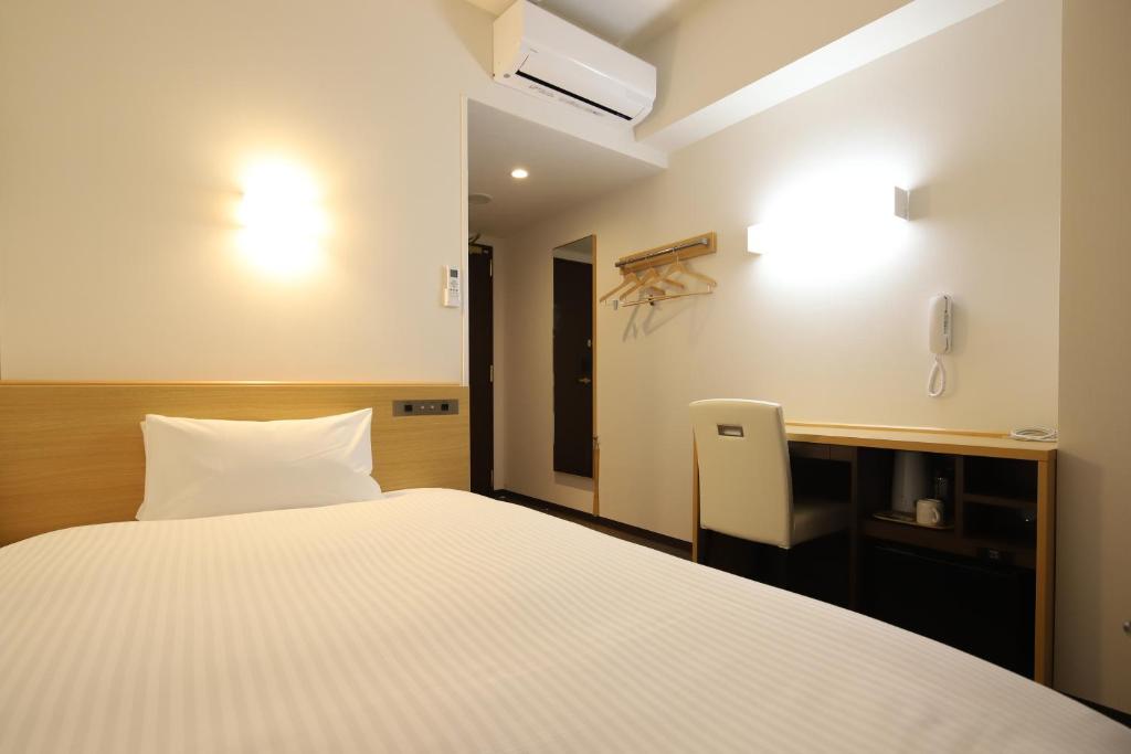 Postel nebo postele na pokoji v ubytování AB Hotel Kani