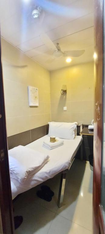 Postel nebo postele na pokoji v ubytování 吉祥賓館 Fortune Inn