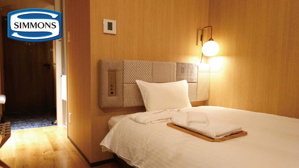 Postel nebo postele na pokoji v ubytování Hotel Nostal Yokote
