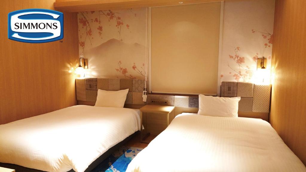 Postel nebo postele na pokoji v ubytování Hotel Nostal Yokote