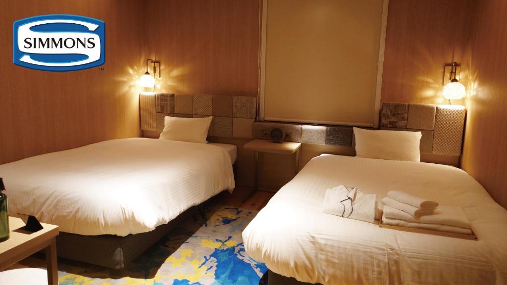 Postel nebo postele na pokoji v ubytování Hotel Nostal Yokote