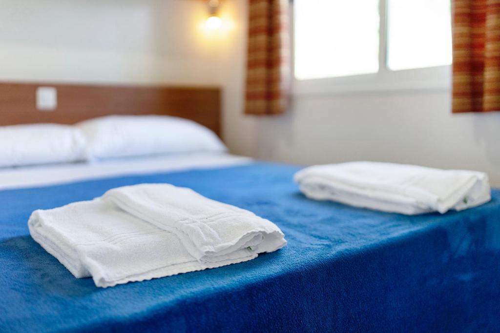 Postel nebo postele na pokoji v ubytování Camping Royal