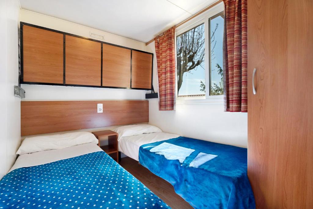 Postel nebo postele na pokoji v ubytování Camping Royal