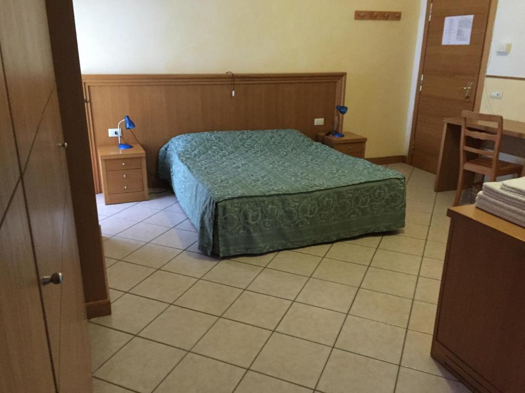 Postel nebo postele na pokoji v ubytování Hotel Vallefura