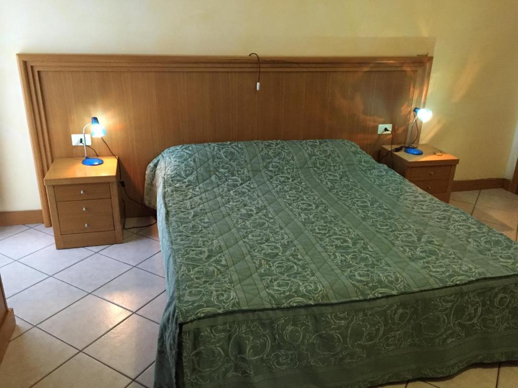 Postel nebo postele na pokoji v ubytování Hotel Vallefura
