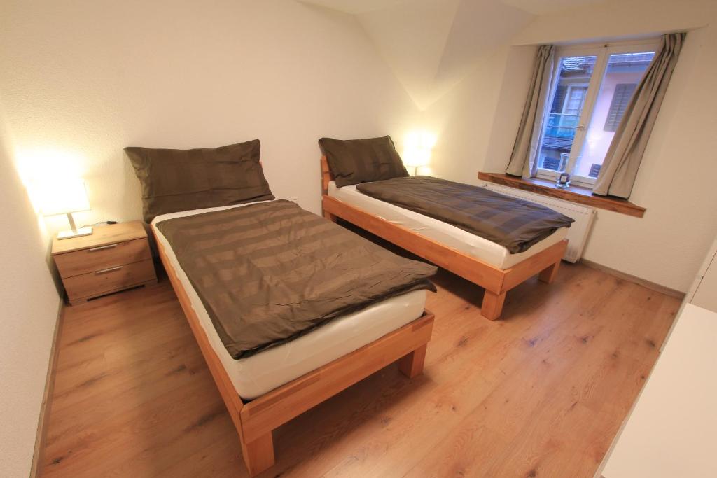 Postel nebo postele na pokoji v ubytování Ferienwohnung am Walensee