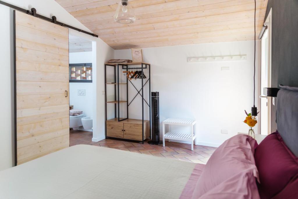 Posteľ alebo postele v izbe v ubytovaní Agriturismo Biomatto