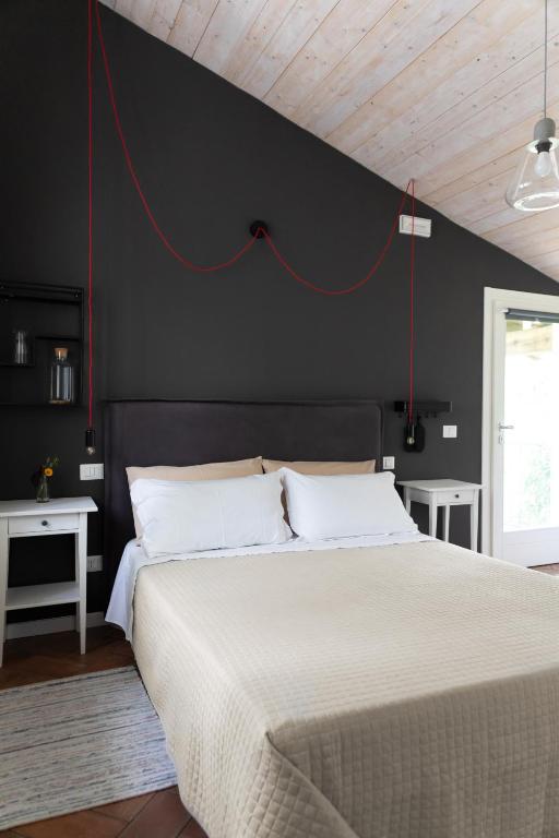 Posteľ alebo postele v izbe v ubytovaní Agriturismo Biomatto