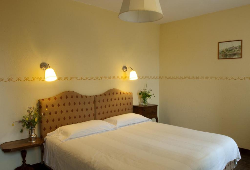 Postel nebo postele na pokoji v ubytování Agriturismo Sant'illuminato