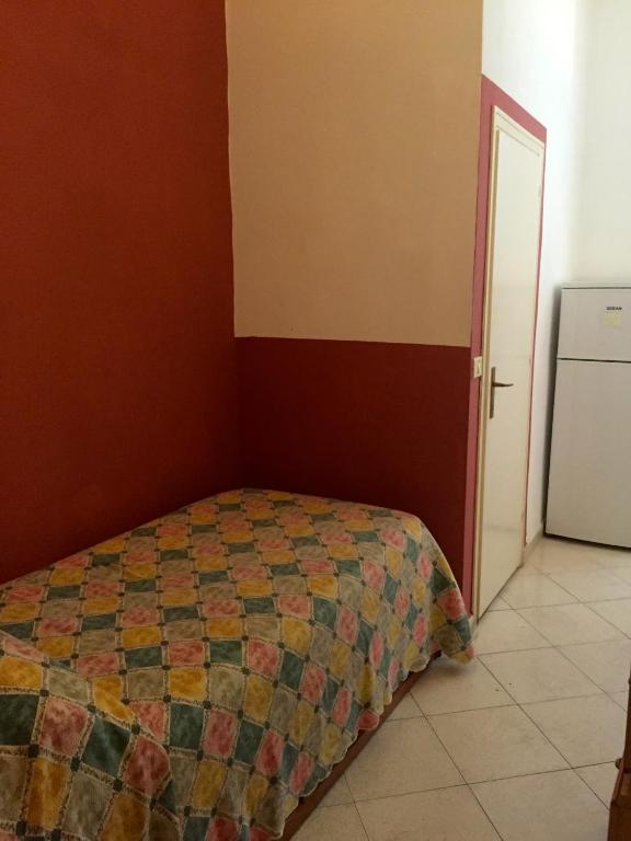 Postel nebo postele na pokoji v ubytování Albergo Ape Elbana