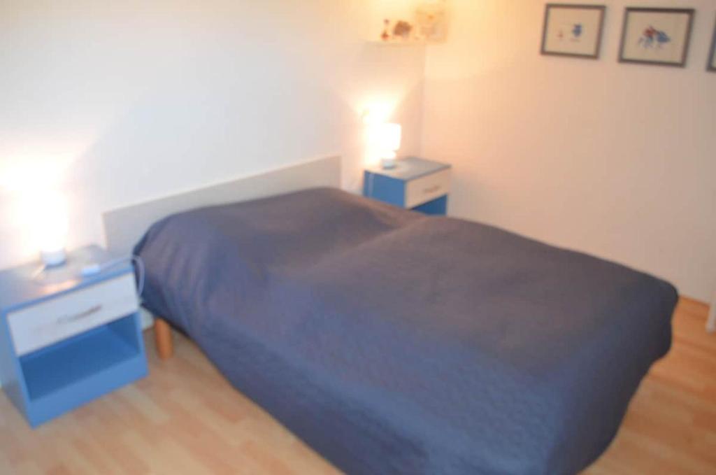 Een bed of bedden in een kamer bij Le clos de la Galiote