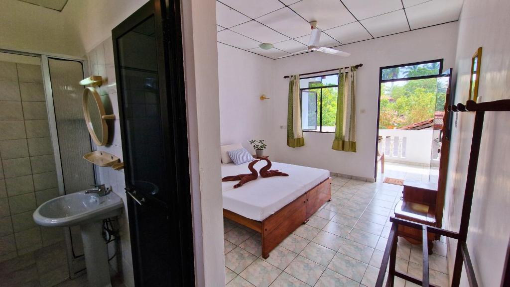 Postel nebo postele na pokoji v ubytování E & C Guesthouse