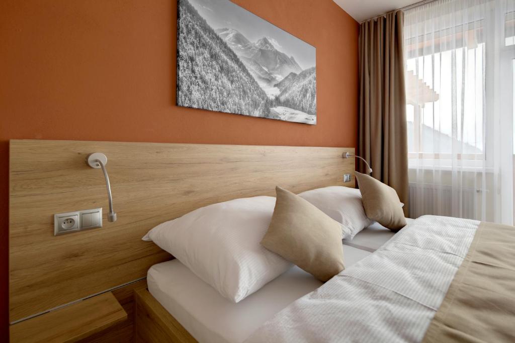 Postel nebo postele na pokoji v ubytování Hotel Havrania