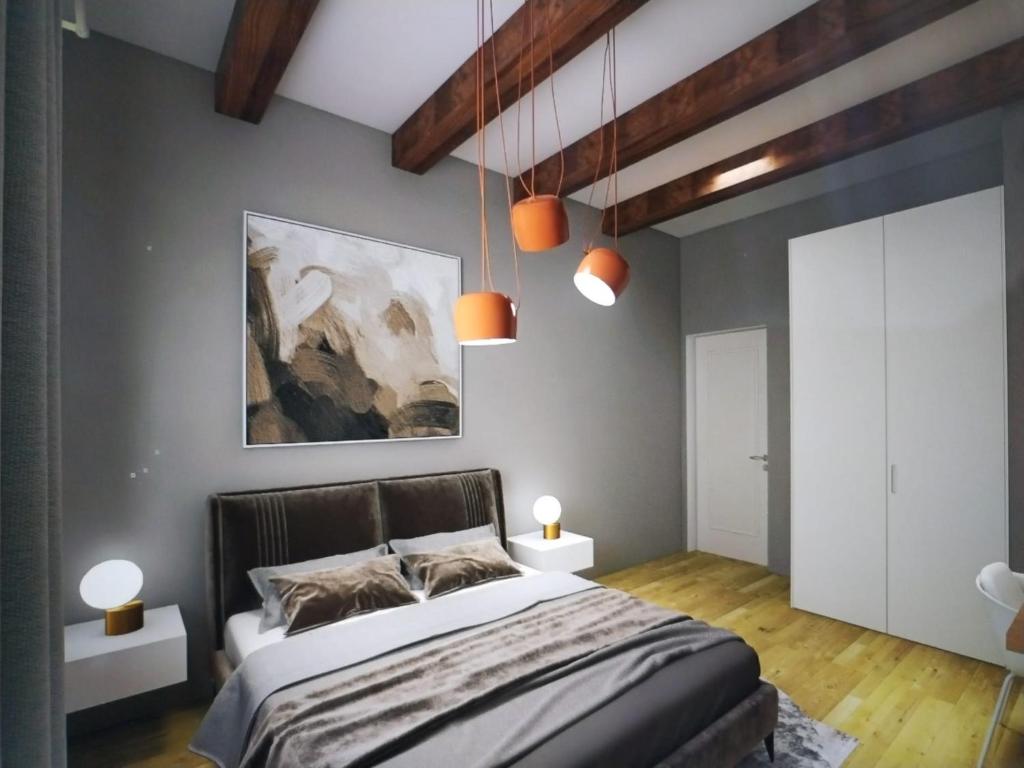 Postel nebo postele na pokoji v ubytování Chiara Rooms