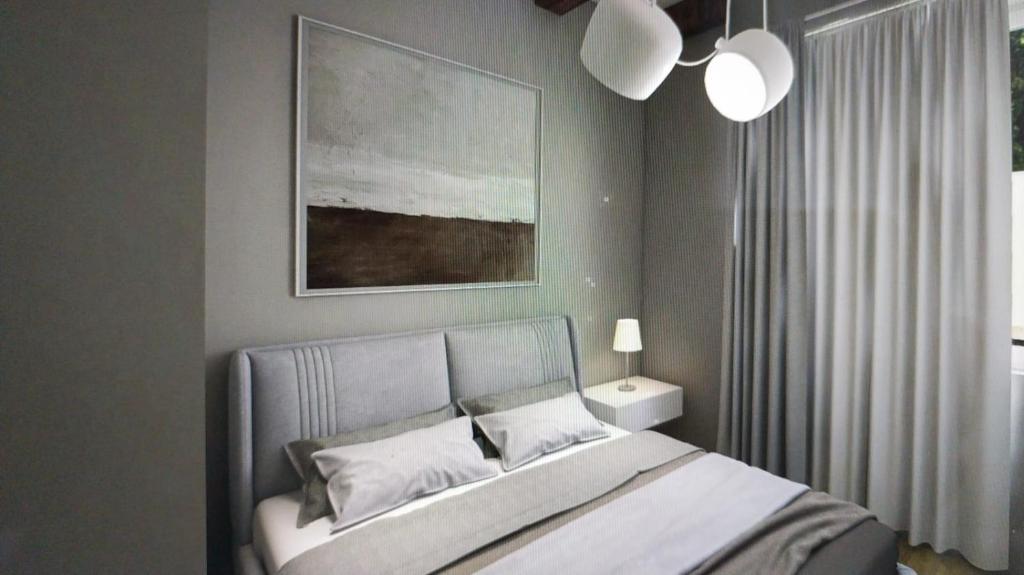 Postel nebo postele na pokoji v ubytování Chiara Rooms