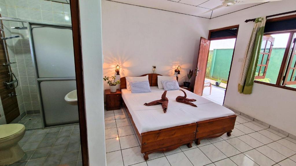 Postel nebo postele na pokoji v ubytování E & C Guesthouse