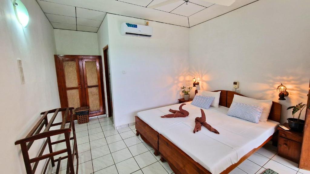 Postel nebo postele na pokoji v ubytování E & C Guesthouse