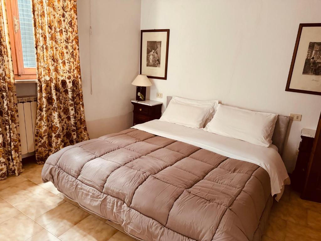 Postel nebo postele na pokoji v ubytování Hotel Le Logge
