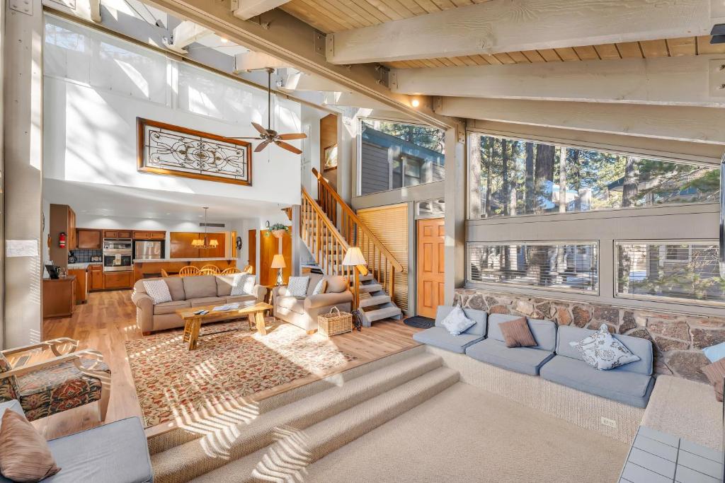 a living room with blue couches and a large window at LLC0804 - Lucky Lady 404 in South Lake Tahoe