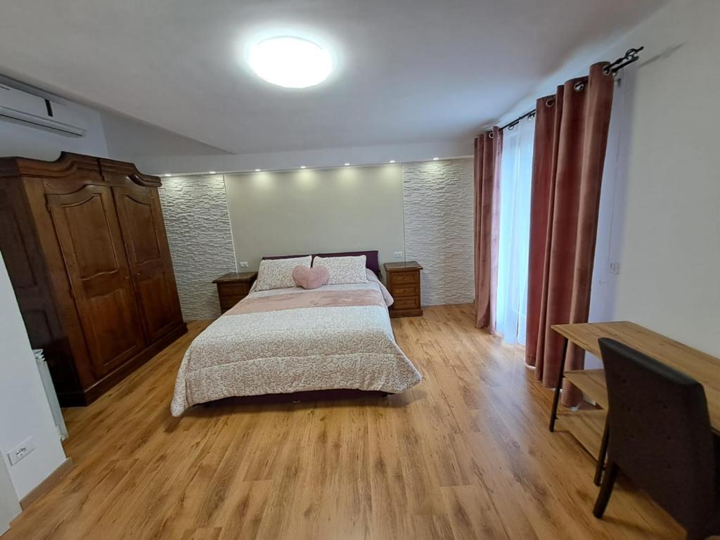 Postel nebo postele na pokoji v ubytování Il Geranio B&B