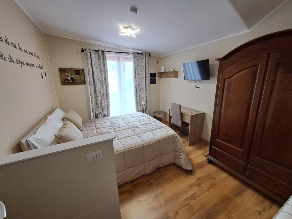 Postel nebo postele na pokoji v ubytování Il Geranio B&B