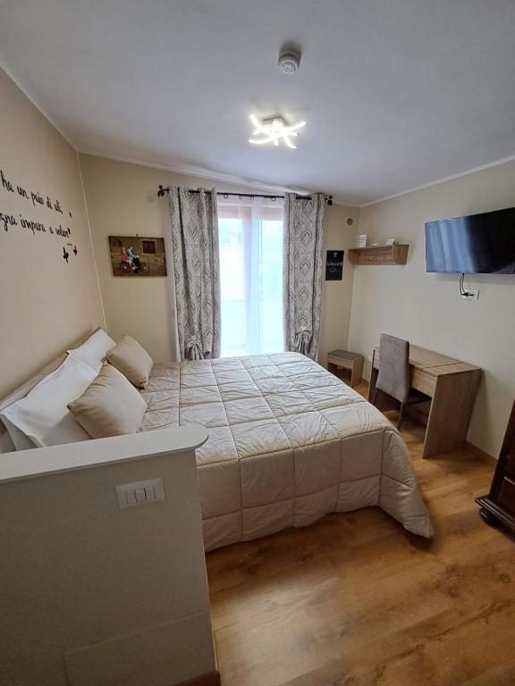 Postel nebo postele na pokoji v ubytování Il Geranio B&B