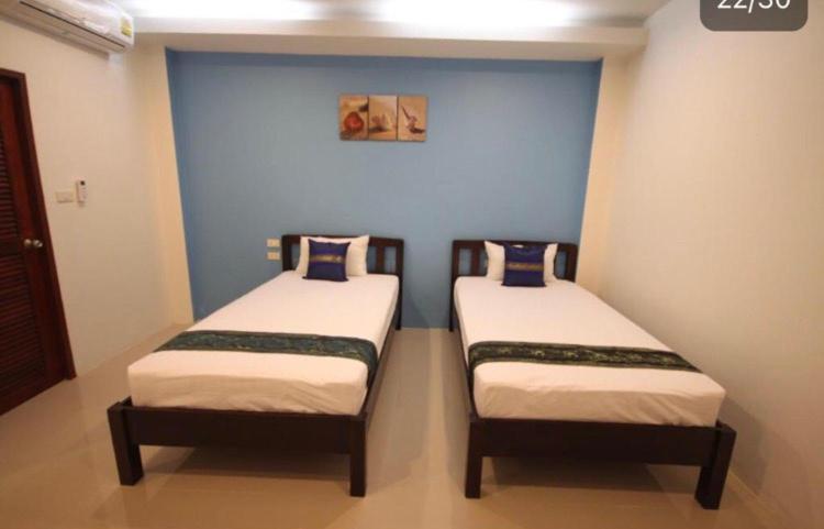 Postel nebo postele na pokoji v ubytování Phangan Guest House