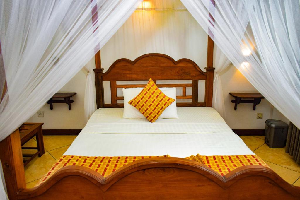 Postel nebo postele na pokoji v ubytování Heli's Villa Unawatuna