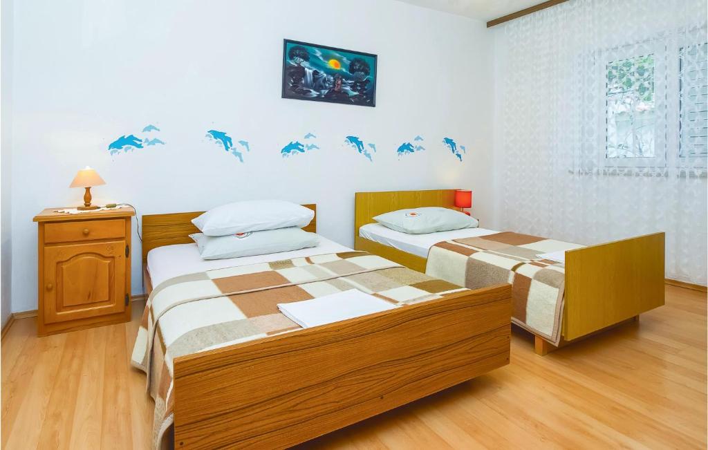 Posteľ alebo postele v izbe v ubytovaní Four-Bedroom Apartment In Omis