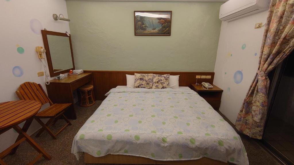 Postel nebo postele na pokoji v ubytování Umin Chu Inn