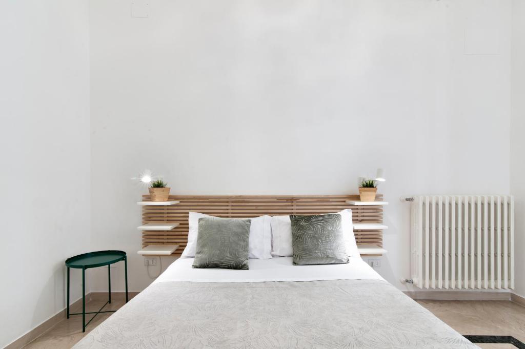 Postel nebo postele na pokoji v ubytování InCentro Comfort Suite - Lecce Selection
