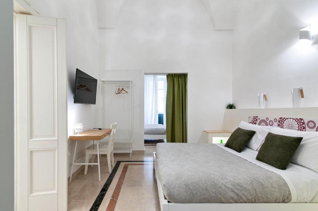 Postel nebo postele na pokoji v ubytování InCentro Comfort Suite - Lecce Selection