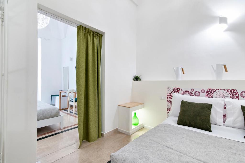Postel nebo postele na pokoji v ubytování InCentro Comfort Suite - Lecce Selection