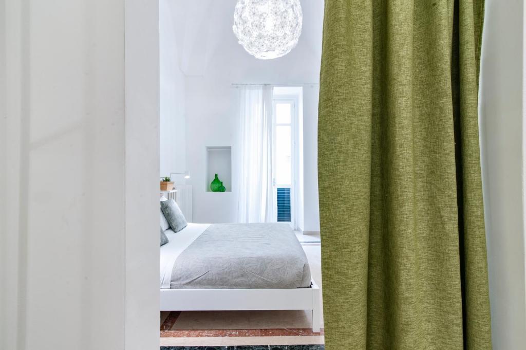 Postel nebo postele na pokoji v ubytování InCentro Comfort Suite - Lecce Selection
