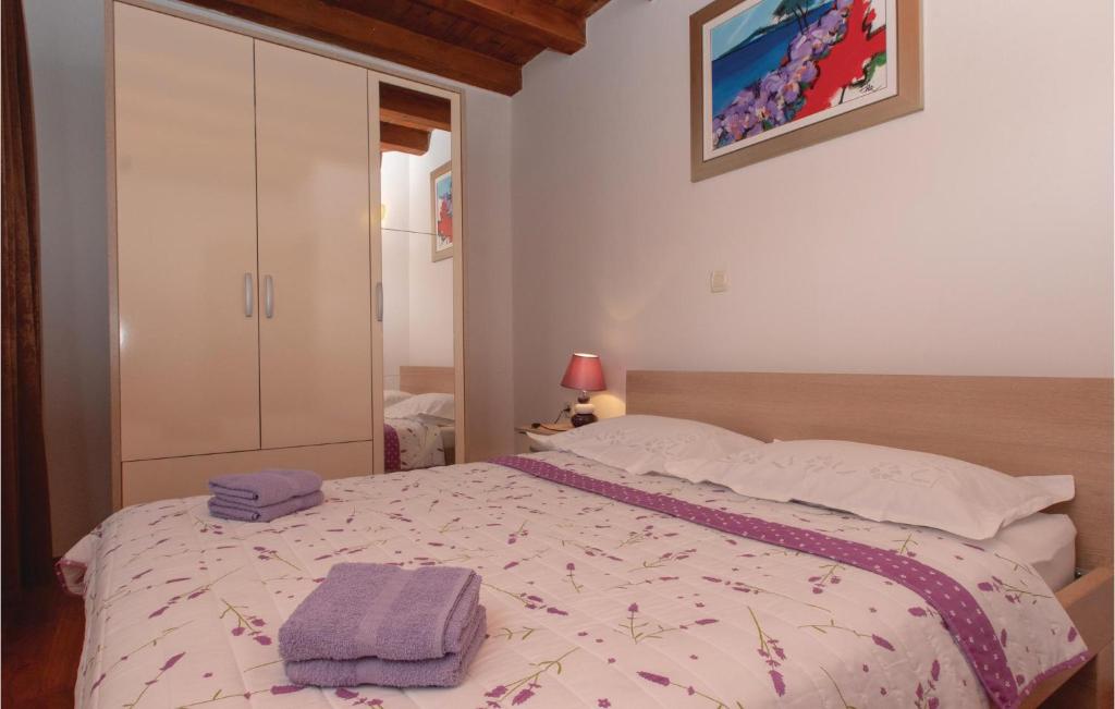 Posteľ alebo postele v izbe v ubytovaní Two-Bedroom Holiday Home In Orebic