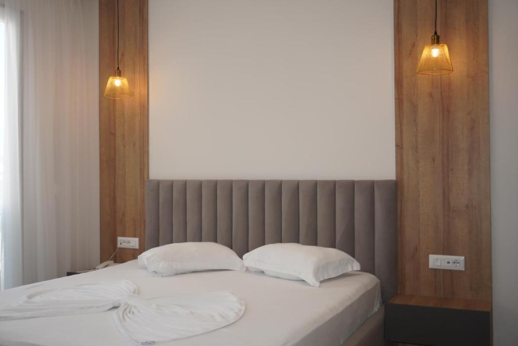 Postel nebo postele na pokoji v ubytování Hotel Colis