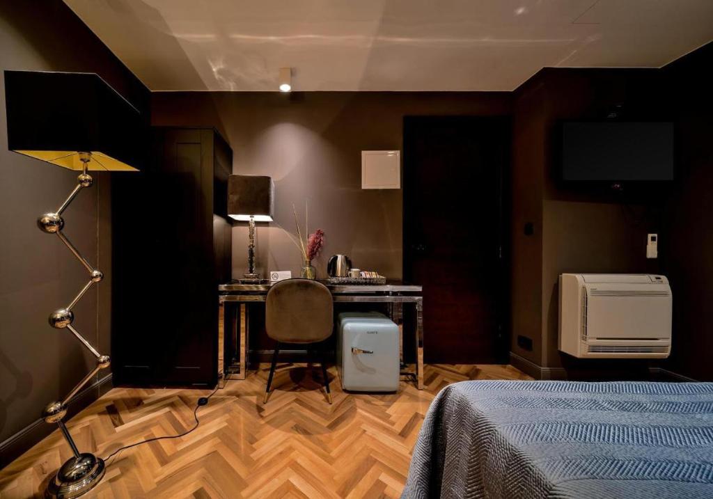 Postel nebo postele na pokoji v ubytování ARTALE 07 Design Rooms II