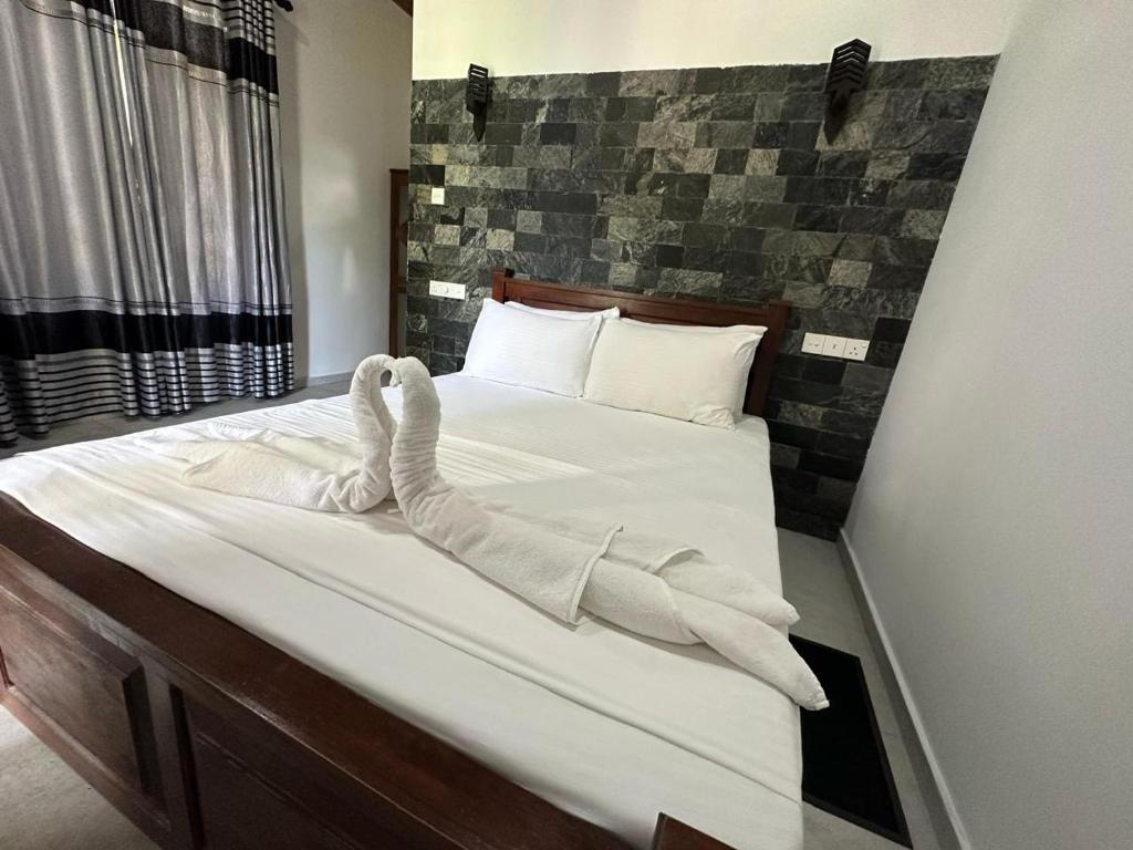 Letto o letti in una camera di Shine Wave Turtle Beach