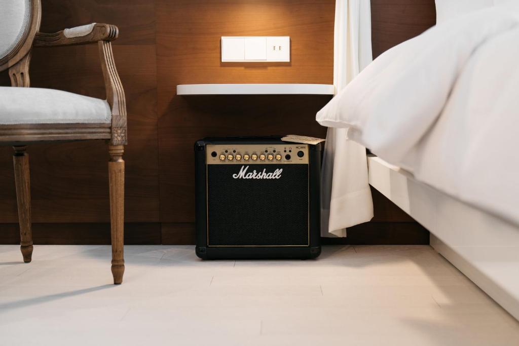 Postel nebo postele na pokoji v ubytování Ruby Rosi Hotel Munich