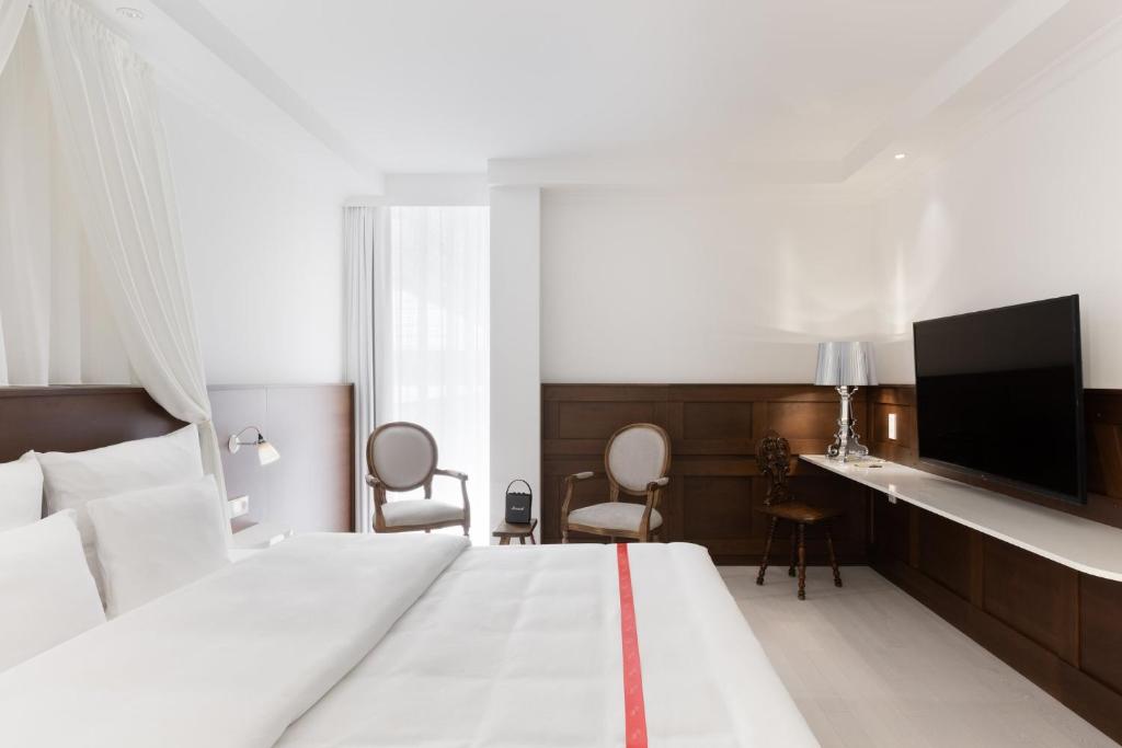 Postel nebo postele na pokoji v ubytování Ruby Rosi Hotel Munich