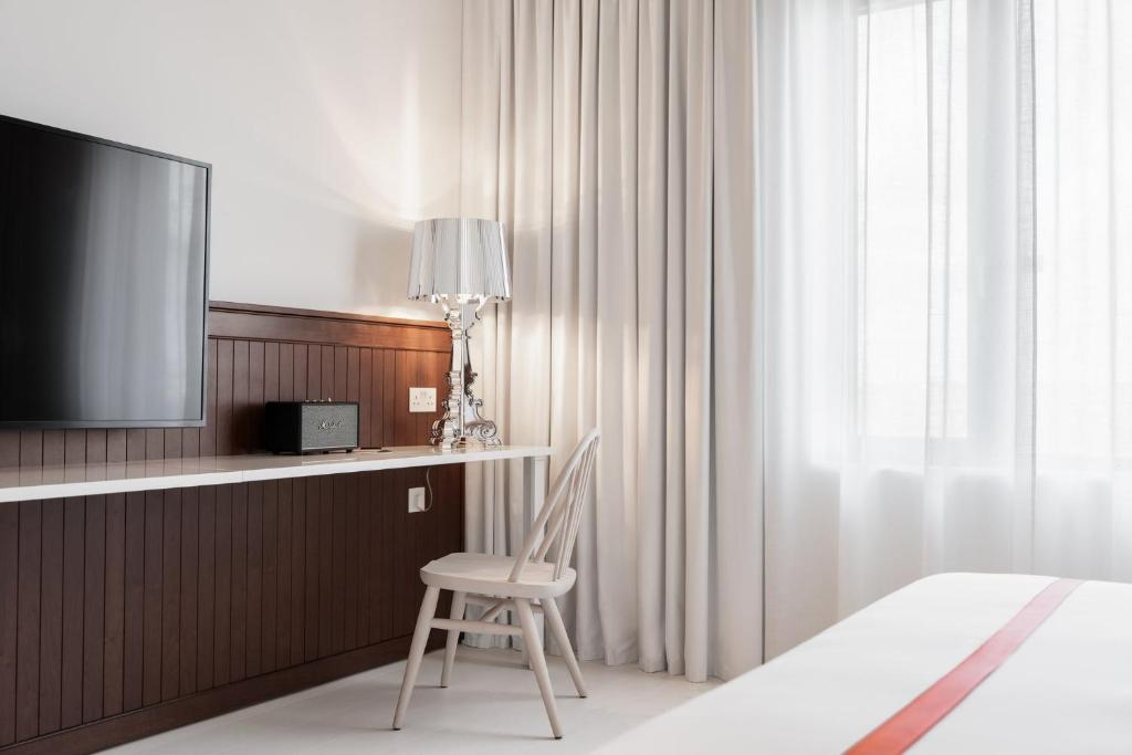 Rúm í herbergi á Ruby Molly Hotel Dublin