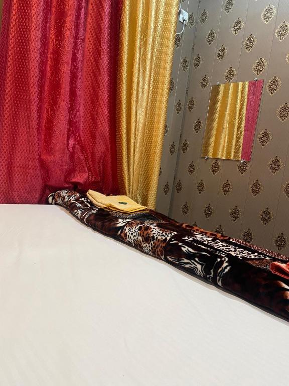 Voodi või voodid majutusasutuse Bajrangbali guest house toas