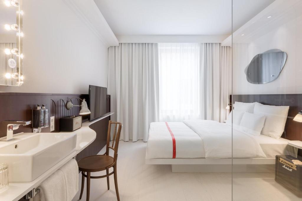 Rúm í herbergi á Ruby Hanna Hotel Stuttgart