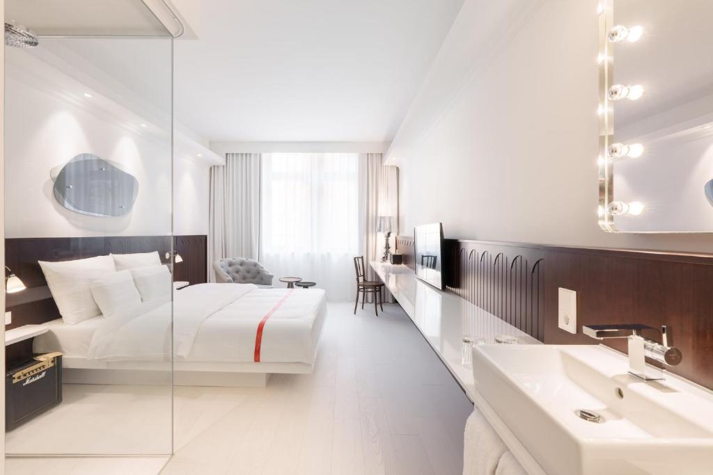 Rúm í herbergi á Ruby Hanna Hotel Stuttgart