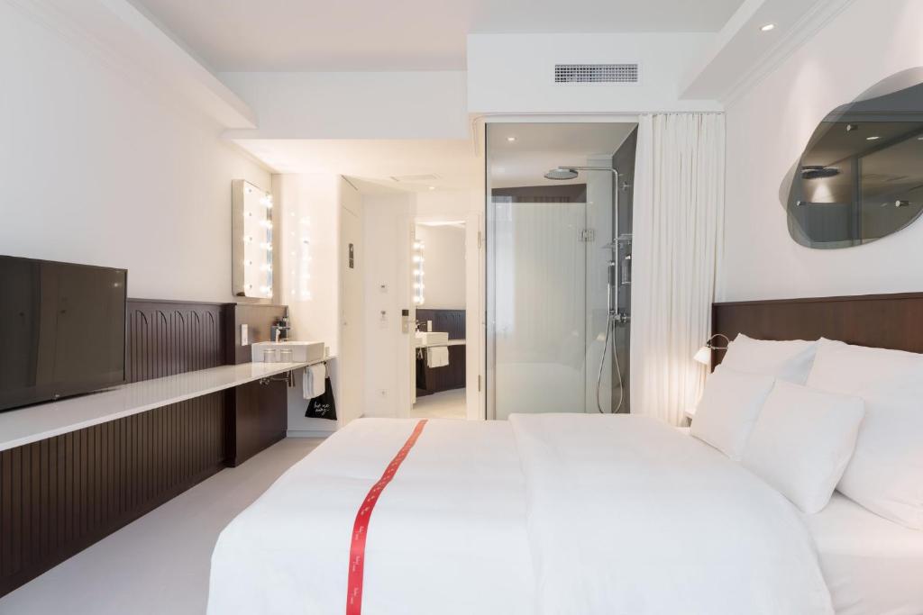 Rúm í herbergi á Ruby Hanna Hotel Stuttgart