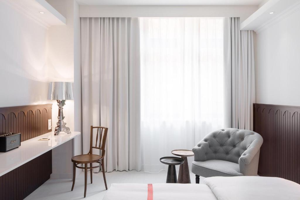 Rúm í herbergi á Ruby Hanna Hotel Stuttgart