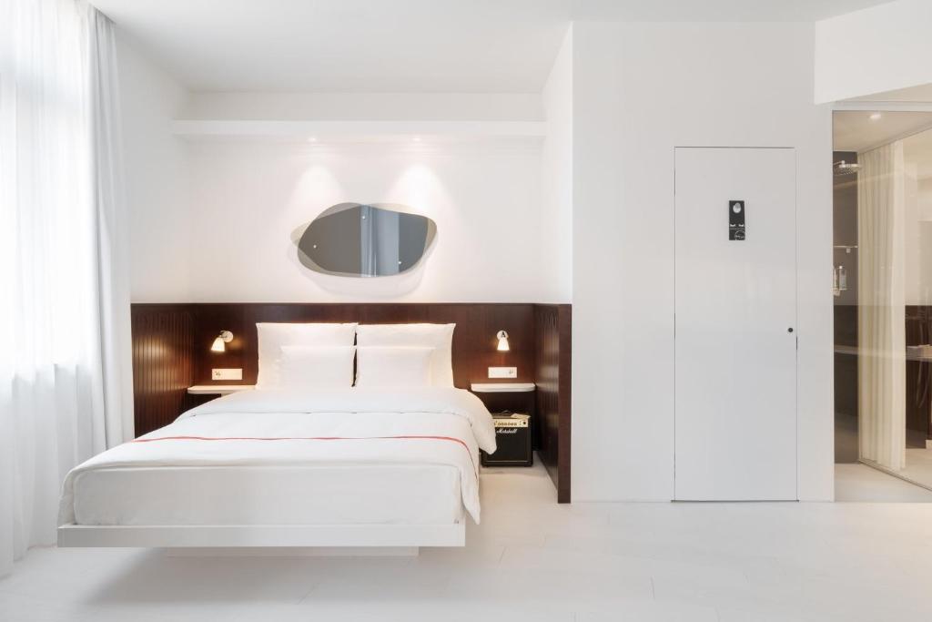 Rúm í herbergi á Ruby Hanna Hotel Stuttgart